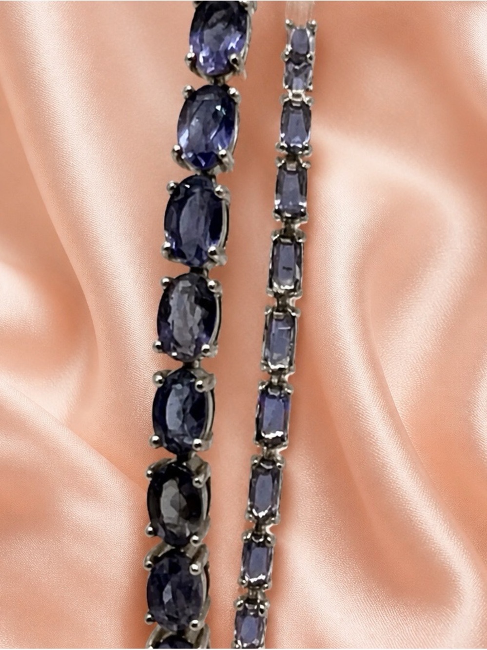 Genuine 13.5ctw Iolite tennis bracelet set in rhodium over S925. 7” long. NEW!